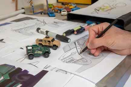 Nir Kahn working on armoured vehicle designs with a carbon-fibre tubed biro pen